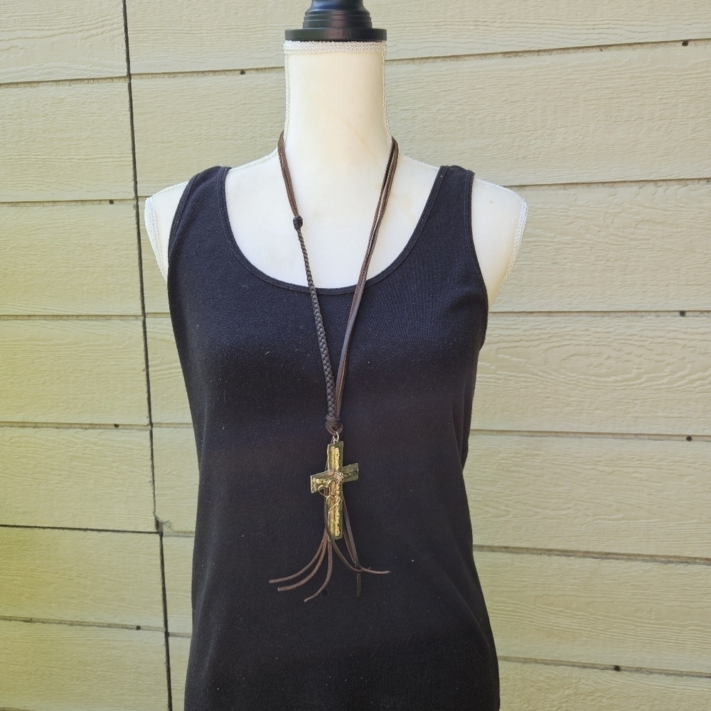 brown leather cord necklace with oversized silver and gold tone cross pendant